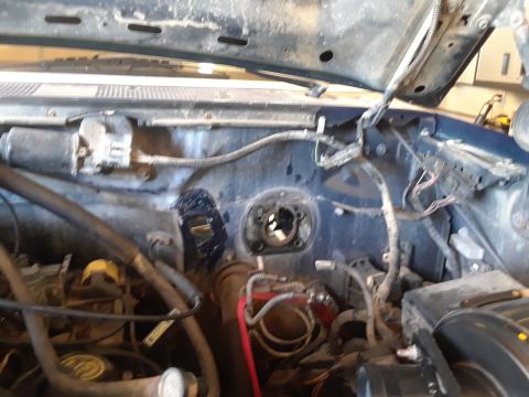 1996 Ford F-350 - Close-up view of the engine bay, showing wiring and various components, some of which are disconnected.