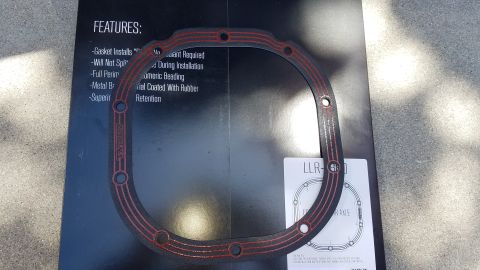 1985 Ford Bronco - Differential gasket and its packaging are shown, with features listed on the box.