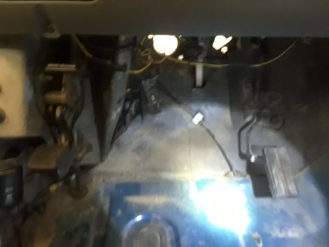 1996 Ford F-350 - Close-up view of the floor area and pedals inside a vehicle, with visible wiring and a website logo.