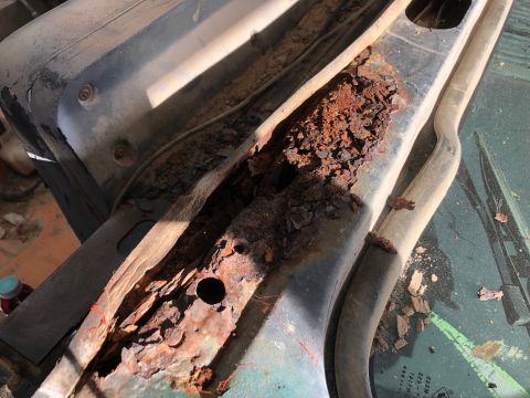 1992 Jeep Wrangler - The vehicle's frame shows significant rust damage, indicating a need for repair or replacement.