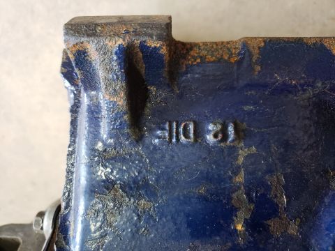 1963 Ford Fairlane - Close-up of a blue cast iron part showing stamped identification numbers.