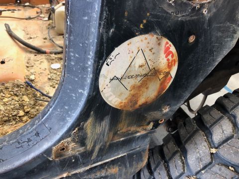 1992 Jeep Wrangler - A close-up view of a weathered vehicle panel shows a sticker with the website 'JEEPAHOLIC.COM'.