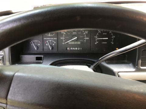 1994 Ford Bronco - The interior dashboard of a 1994 Ford Bronco displays the speedometer, fuel gauge, and RPM meter.