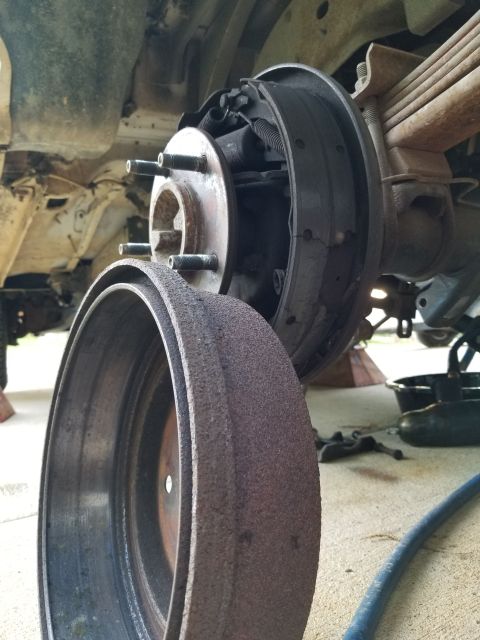 1983 Ford Bronco - Not a moment too soon... Not only is this shoe disintegrating; the autoadjuster cable is caught between it & the backing plate. No wonder t…