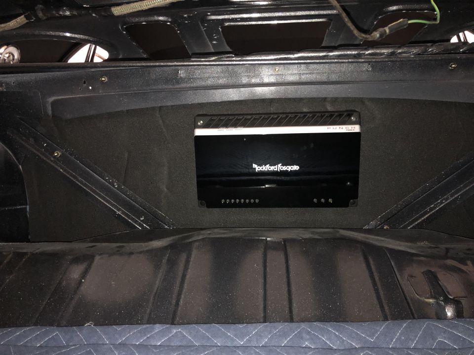 Rockford Fosgate Punch amplifier mounted in car trunk