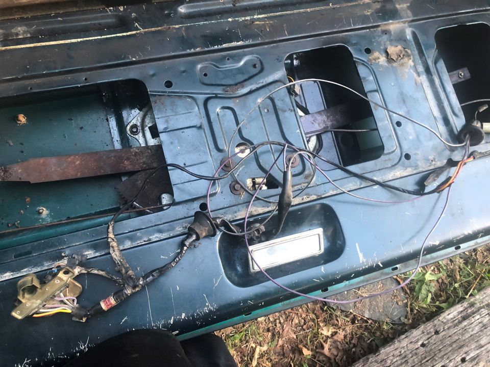tailgate interior showing wiring harness and window mechanism components