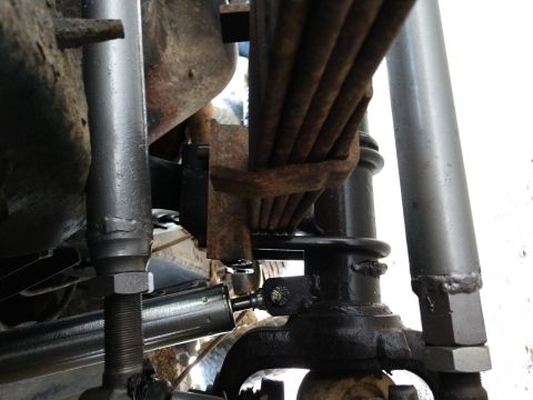1995 Ford Bronco - Vehicle suspension components, including leaf springs and shock absorber, are visible in this close-up.