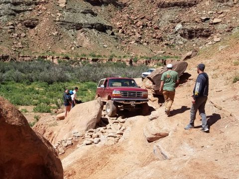 1995 Ford Bronco - Bronco tackles a challenging off-road course in a desert canyon.