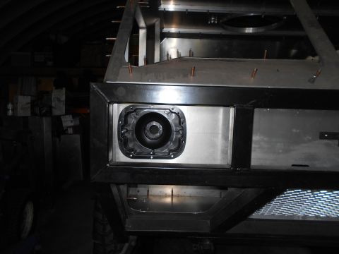 1992 Ford Bronco - A close-up view of a black, circular part installed in a metal frame, likely a headlight or speaker housing, on a custom vehicle build. The…