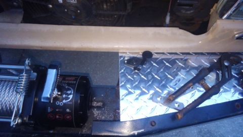 1990 Ford F-250 - mounted the remote plug here and extedned the wiring to the solenoid. makes it easier to use the winch controller from inside the cab
