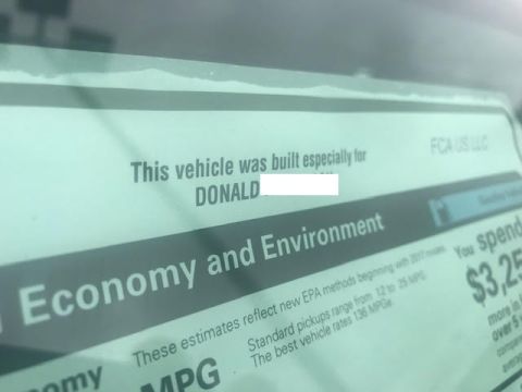 2000 Ford Crown Victoria - A close-up view of a vehicle's window sticker shows text that reads "This vehicle was built especially for DONALD" followed by a white rect…