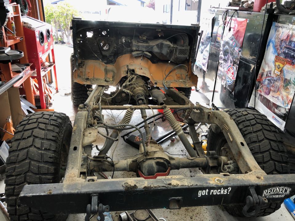 Jeep Wrangler chassis with large tires, "got rocks?" and "REDNECK COWBOY" text.