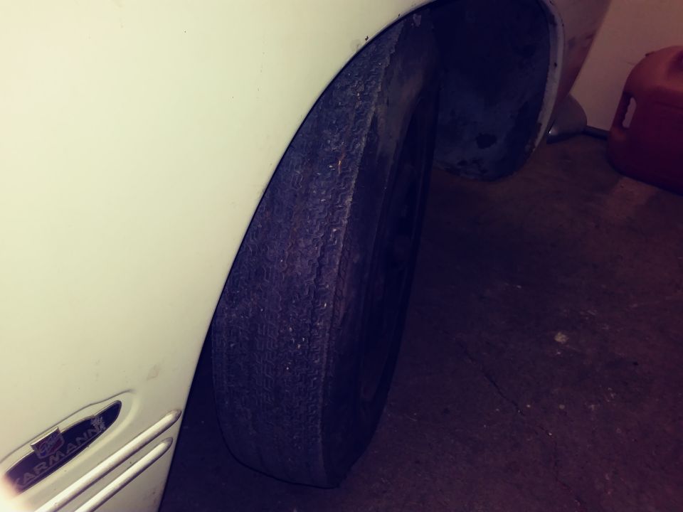 White 1969 Volkswagen Karmann Ghia rear wheel well and tire
