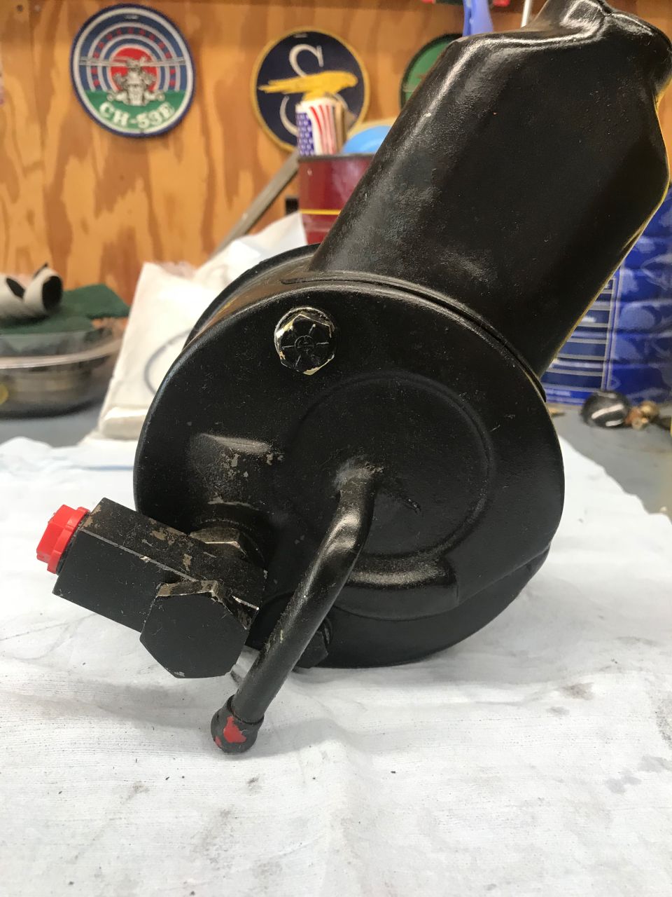 Black power steering pump with red cap fitting