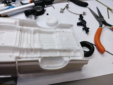 1995 Ford Bronco - To lower the truck some more would take some chopping. I marked out the locations of the spring mounts at their centers. Then I removed the…