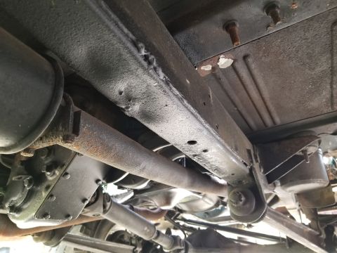 1974 Ford Bronco - We still haven't figured out how the frame got dented here, under the RHF seat. Apparently, many of the holes in the floor were taped befor…