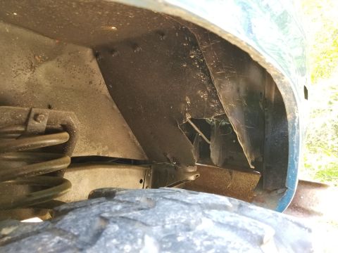 1974 Ford Bronco - I guess a blowout or road debris caused this damage to the RHF wheelwell.