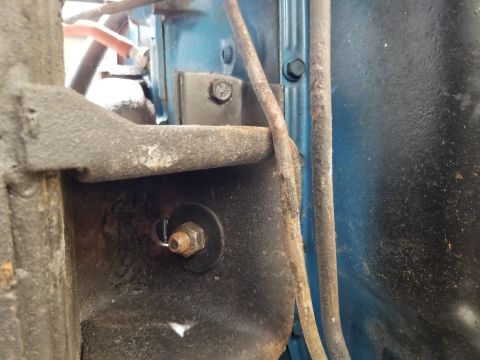 1974 Ford Bronco - One of the transmission cooler lines is lightly touching the RHS engine perch.