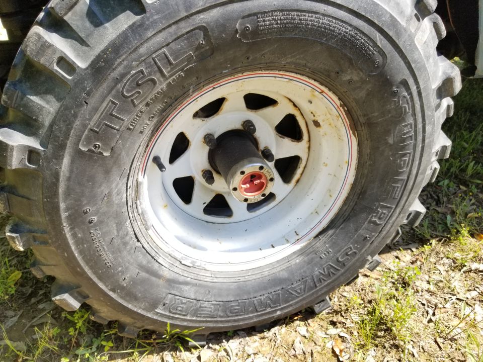The hub lock knobs are seized, and seem to have been so for quite some time.  I haven't checked the date codes on the tires yet, but the first repairs to the truck are to prepare it for new tires.