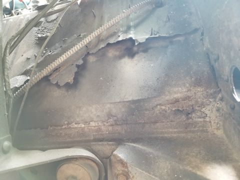 1974 Ford Bronco - Apparently, many of the holes in the floor were taped before being flooded with Bondo. Then, more steel was screwed, welded, & seam-sealed…