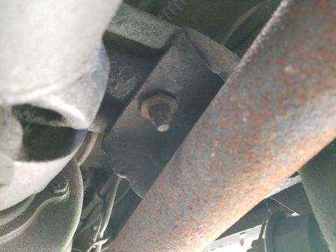 1974 Ford Bronco - Both transmission crossmember bolts are finger-loose. All the U-joints seem to be OK, but the exhaust system is dead weight.