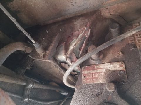 1974 Ford Bronco - Apparently, many of the holes in the floor were taped before being flooded with Bondo. Then, more steel was screwed, welded, & seam-sealed…