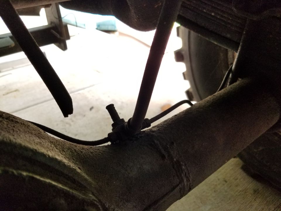 Both differential vent tubes are broken off.

UPDATE: They've been replaced with silicone tubing.