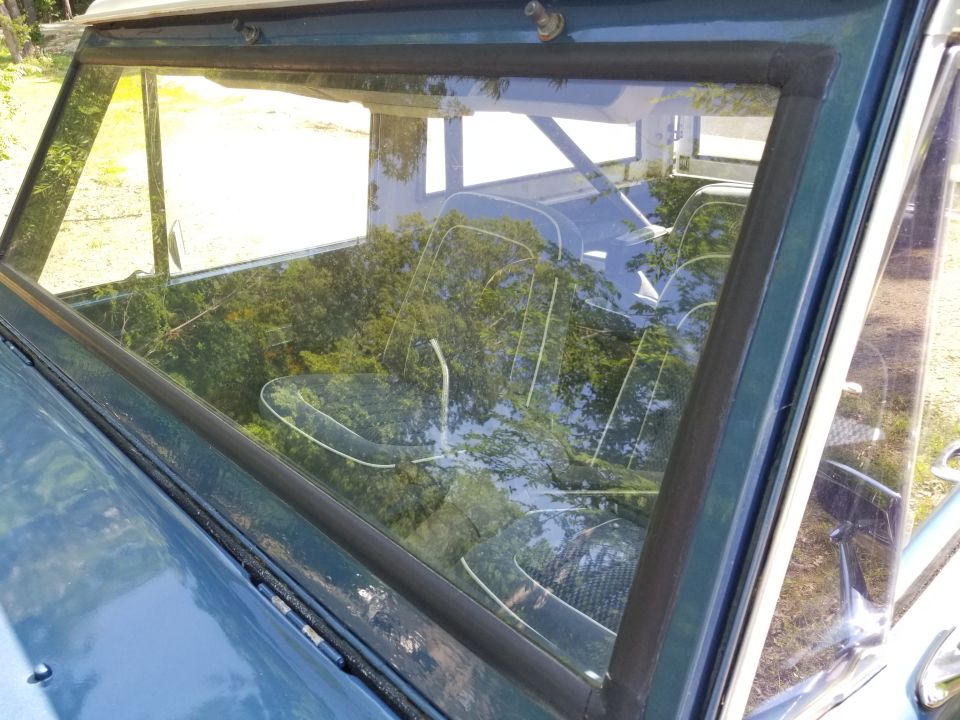 There are no wiper arms, but the linkage isn't installed correctly inside, and the cover isn't attached to anything but the visor rods & maybe a dome light wire.  Bedliner is visible at the top of the firewall, between the hood & w/s frame.  The window gaskets are shot, but so are the few other body seals that are installed.  There's a box full of new seals.