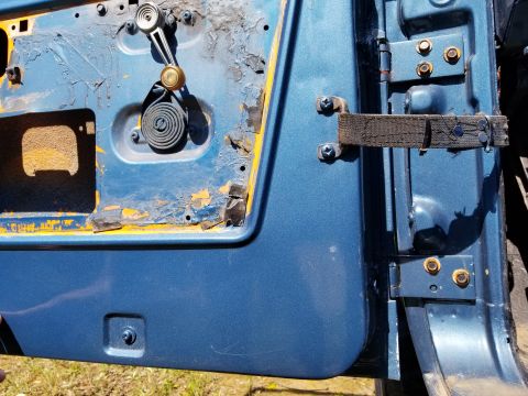 1974 Ford Bronco - I think at least one of the door limit strap bars needs to be turned around so the door doesn't swing as far.