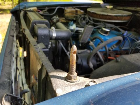1974 Ford Bronco - The core support is bowed forward; and the hood pins are not installed well, or in good condition.