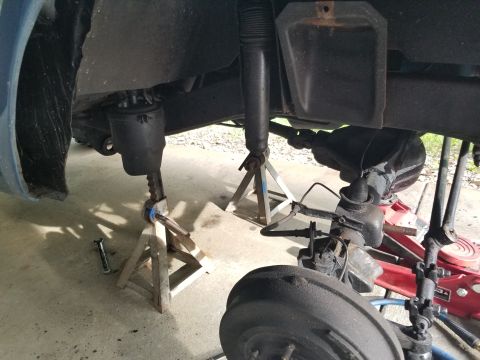 1974 Ford Bronco - I cup-brushed the rusty axle perches down to shiny metal; later, I spray-painted them, and applied a light film of silicone grease (include…
