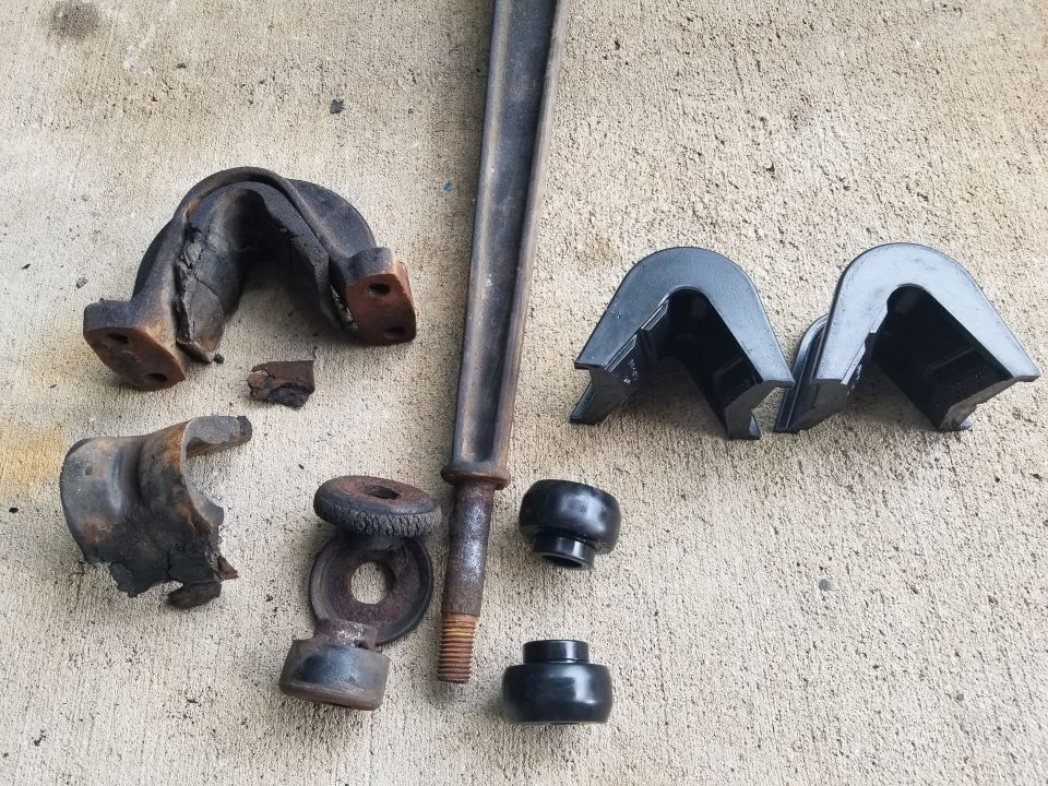 These might have been factory 1974 bushings, judging by their condition.

It's critical to pay attention to the instructions molded into the C-bushings so they're installed properly.  Installing them wrong induces "Bronco lean", and all this work has to be re-done to rearrange the bushings correctly.