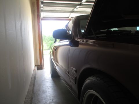 2004 Ford Crown Victoria - A dark red sedan is parked inside a garage with its hood open, viewed from the side.