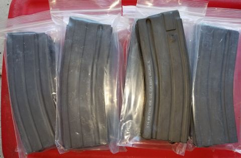 2000 Ford Crown Victoria - Four rifle magazines are packaged in plastic, with one clearly marked with manufacturer and location details.
