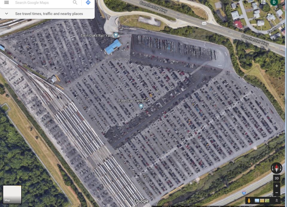 Aerial view of Twin Oaks Rail Yard car lot with many vehicles parked