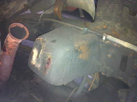 1978 Ford Bronco - Undercarriage view shows significant rust and wear on various parts, including an exhaust pipe.