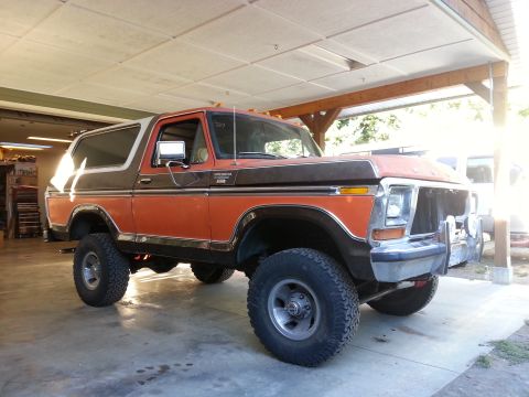 1978 Ford Bronco - This 1978 Ford Bronco is parked in a garage with its front end partially disassembled.