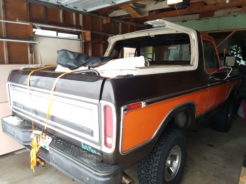 1978 Ford Bronco - This 1978 Ford Bronco features a two-tone brown and orange paint scheme with its removable top detached.