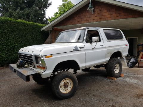 1978 Ford Bronco - This 1978 Ford Bronco is shown from a three-quarter front angle, lifted and modified with a custom bumper.