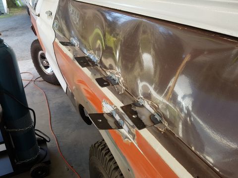 1978 Ford Bronco - Vehicle body repair in progress, showing welding work on the side panel.