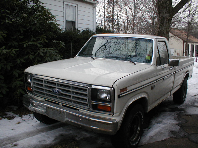 White 1986 Ford F-150 pickup truck, 3/4 front view