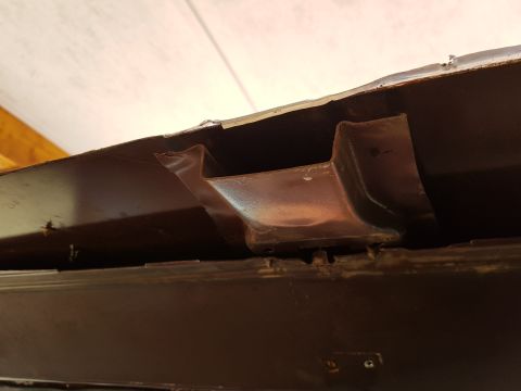 1978 Ford Bronco - Close-up of corroded metal bracing, showing signs of wear and tear.