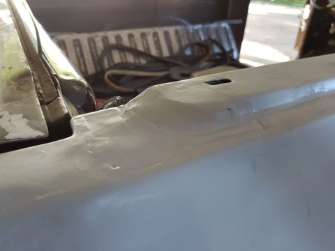 1978 Ford Bronco - Close-up view of a vehicle's interior dashboard area, showing white and black elements, with a Supermotors watermark at the bottom right.