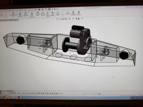 1978 Ford Bronco - SolidWorks screenshot of a Front Bumper Assembly model showing a winch mounted in the center with transparent bumper shell and mounting bra…