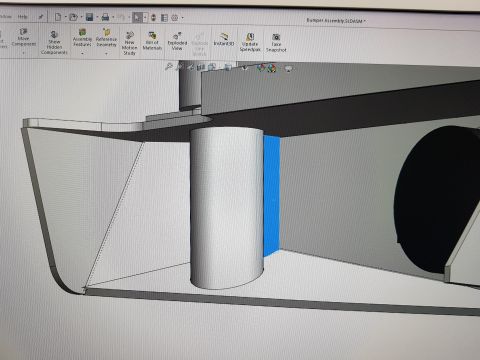 1978 Ford Bronco - SolidWorks model detail of a front bumper assembly showing the winch drum cylinder and a highlighted mounting plate face within the bumper…