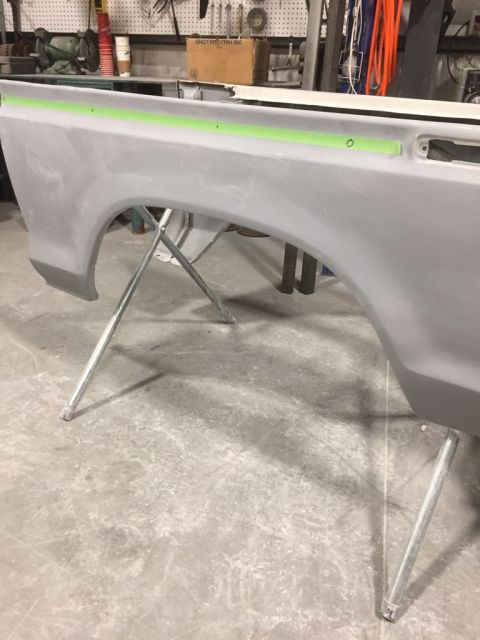 1978 Ford Bronco - Car body panel undergoing preparation in a workshop environment.