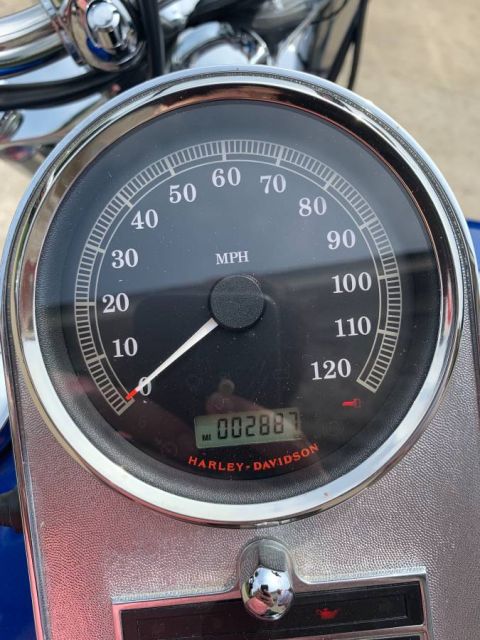 2008 Harley-Davidson Softail - The speedometer shows 2,887 miles and the Harley-Davidson logo is visible on the gauge.