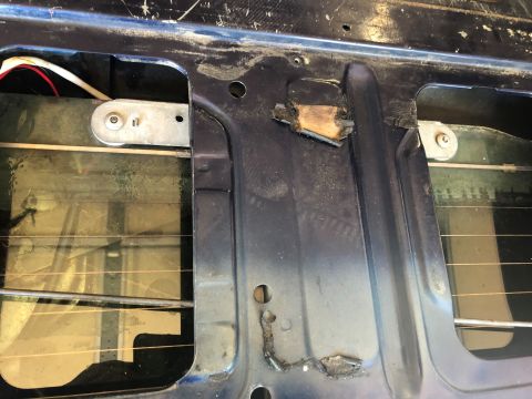 1995 Ford Bronco - Close-up view of the internal mechanism for a tailgate window repair.