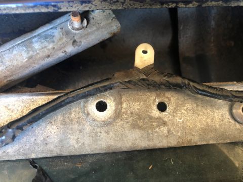 1995 Ford Bronco - This image shows a close-up view of a vehicle's window regulator mechanism, likely during a repair process.