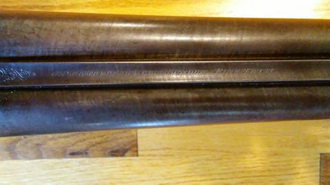 1994 Ford Bronco - Engraved text is visible on the barrel of a shotgun resting on a wooden surface.